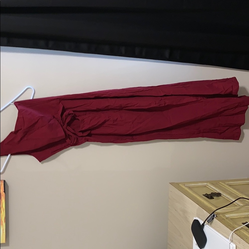 Red jumpsuit with cut out stomach and front bow